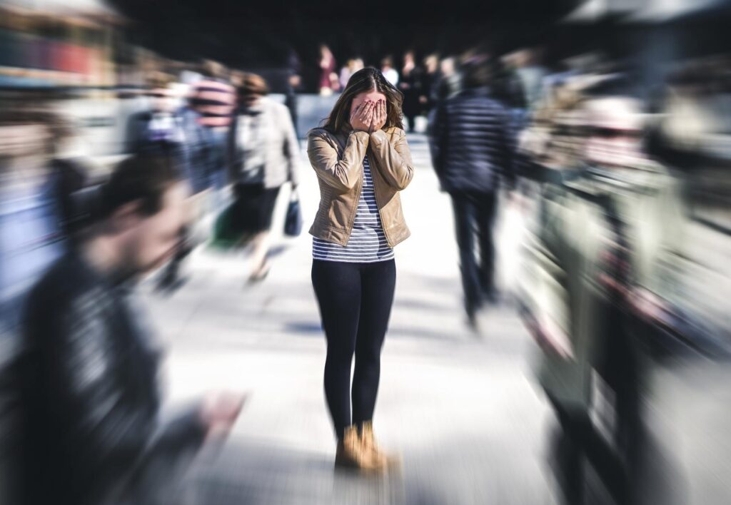 Anxious woman in a crowd