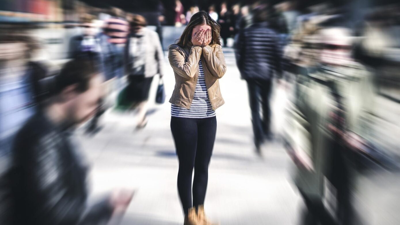 Anxious woman in a crowd