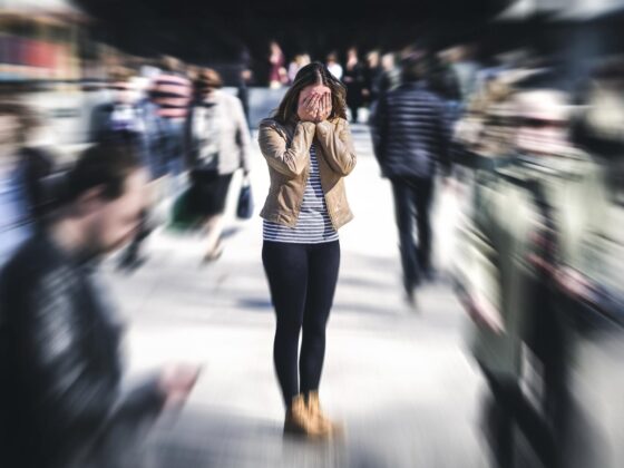 Anxious woman in a crowd